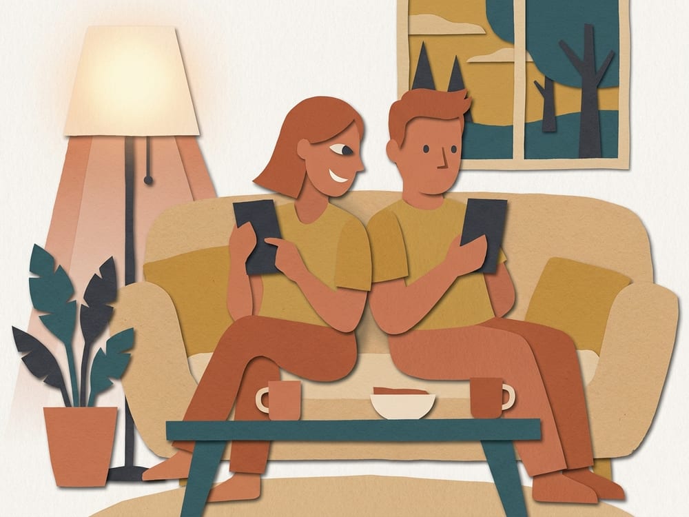 Two friends side by side on a sofa, racing the same exercise on their phones